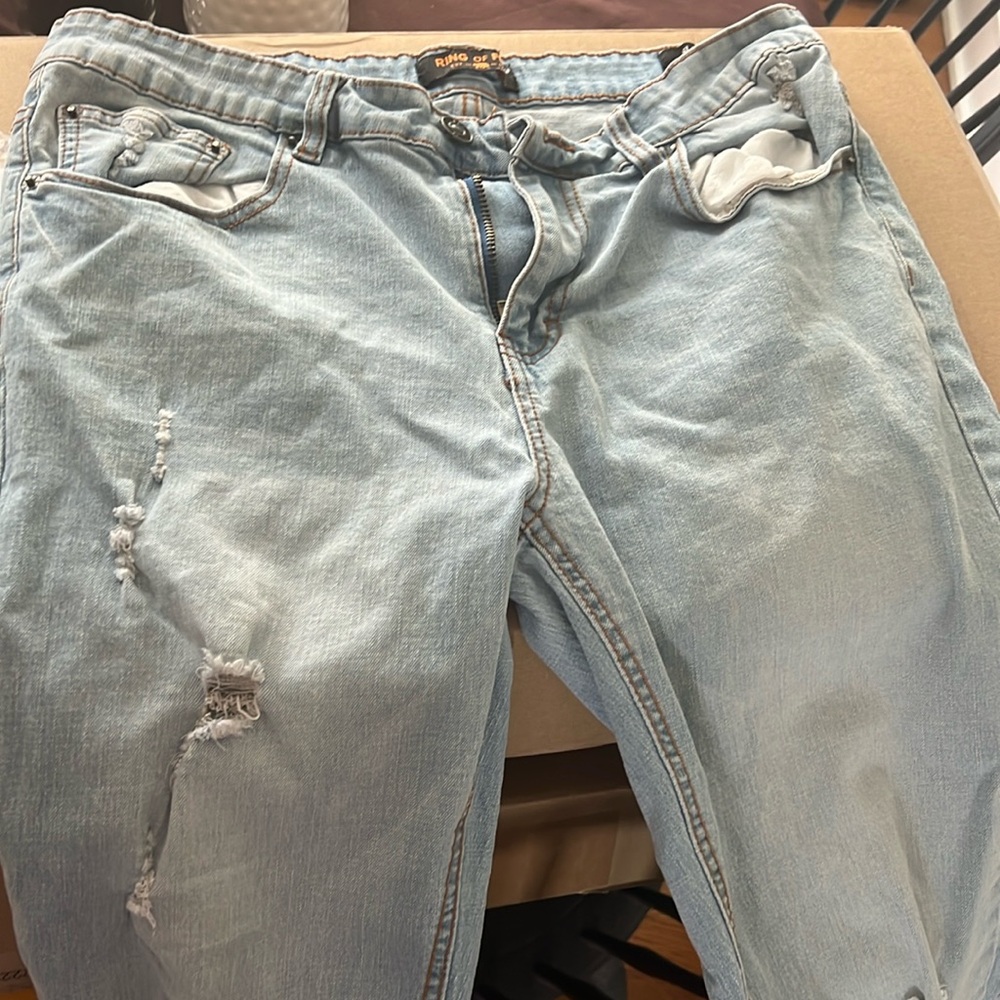 Small ripped denim jeans